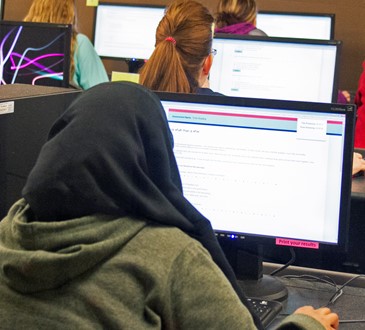 students at computers in testing center