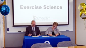 President Hanson signing agreement for exercise science bachelor degree with Southwest Minnesota State University President Gores