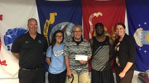 (From left) Anoka-Ramsey Community College President, Kent Hanson; military-connected Anoka-Ramsey student, Megan Giddens; Marine Corps Veteran and Spring Lake Park Lions member, Leo Luskey; Marine Corps Veteran and Anoka-Ramsey student, Yinka Jerry; and Anoka-Ramsey Development Director, Lindsey Schiller pose together as Anoka-Ramsey Community College accepts a $5,000 donation from the Spring Lake Park Lions Club to benefit veteran students who attend the college.
