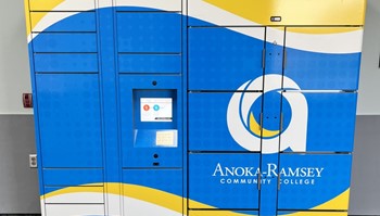 Self-service food pantry lockers featuring a blue and yellow design with the college logo.